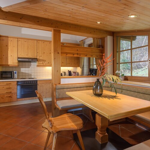 Cozy wooden kitchen with dining nook and bench seating