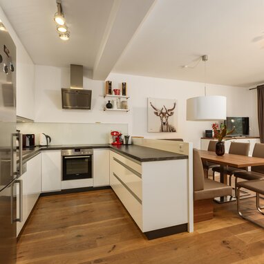 Open-plan kitchen with island and dining area.