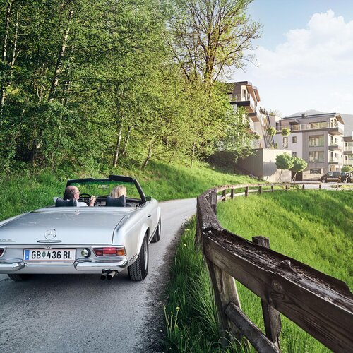 Silver convertible with two passengers on a rural road | © RaphaelGabauer