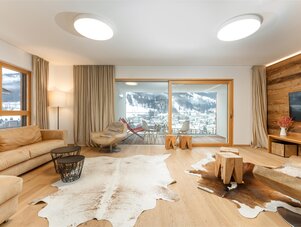 Bright living room with beige sofa and balcony view